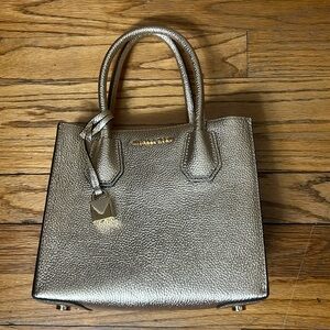 Michael Kors gold handbag. Never used.